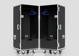 Two black Touring Wardrobe Cases with wheels, hanging rods, blue hangers, lower shoe drawers, and side metal handles. Each measures 1179 x 680 x 1569 mm.