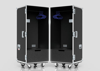 Two black Touring Wardrobe Cases with wheels, hanging rods, blue hangers, lower shoe drawers, and side metal handles. Each measures 1179 x 680 x 1569 mm.