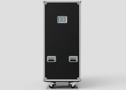 The Touring Wardrobe Case with Shoe Drawers is a tall black case with metal corners and two handles on the lower front, upright on wheels against a plain background, with external dimensions of 1179 x 680 x 1569 mm.