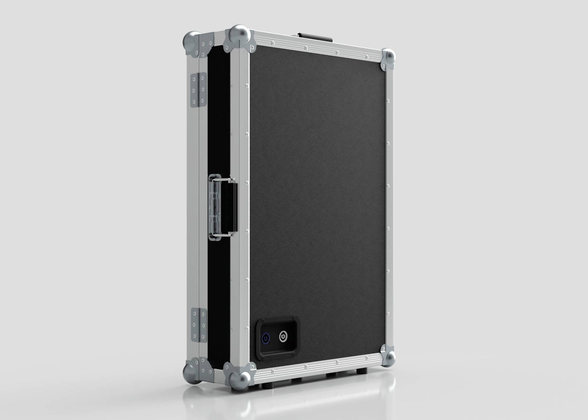 The Vanity Dressing Room Makeup Mirror Case is a black and silver hard-sided case with metal edges, corner protectors, a side handle, and a small rectangular power port on one side.