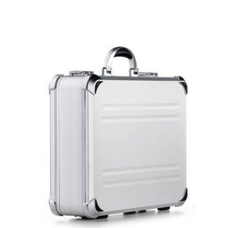 The VDK 97300 is a silver aluminium case with metallic corners, a handle, and custom CNC foam fittings, shown standing upright on a white background.