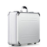 The VDK 97700 features a silver aluminium case with black corner protectors, custom CNC foam fittings, and a metal handle, shown upright on a white background.