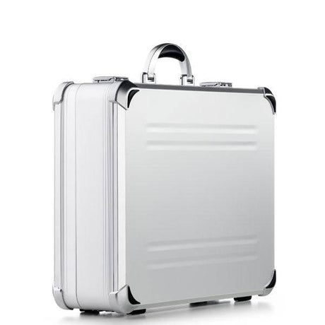 The VDK 97700 features a sleek aluminium case with custom CNC foam, silver hard shell, black corner protectors, and a sturdy handle, shown against a plain white background.
