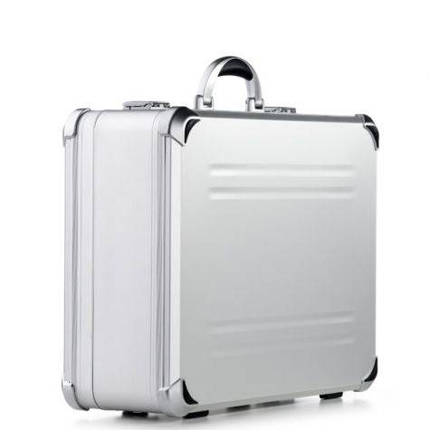 The VDK 97800, a silver aluminium case with metal corners and handle, is shown on a plain white background and features custom CNC foam fittings for secure storage.