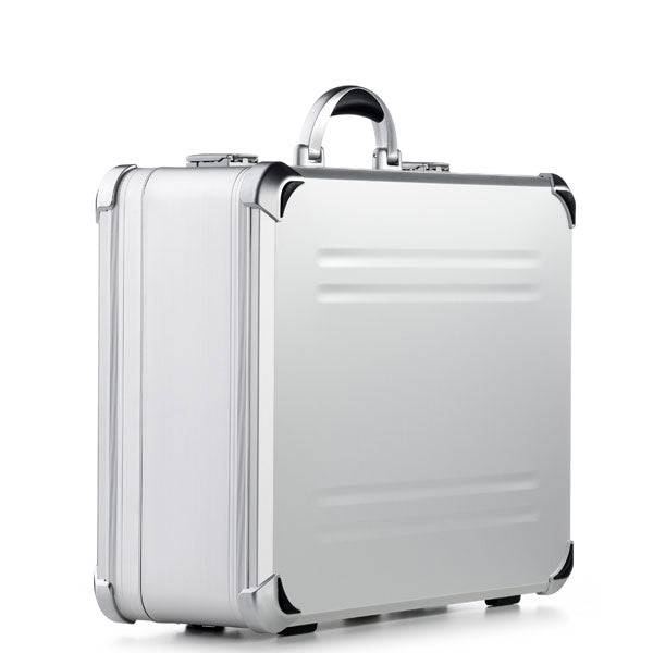 The VDK 97800 is a silver aluminium case with reinforced corners, a black handle, and custom CNC foam fittings, shown standing upright on a white background.