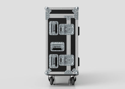 The Yamaha DM7 Case, a black and silver birch panel flight case with metal reinforcements, handles, and latches, stands upright on wheels against a plain background.